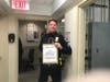 Garden City police officer receives GCHS Class of 2021 letters.