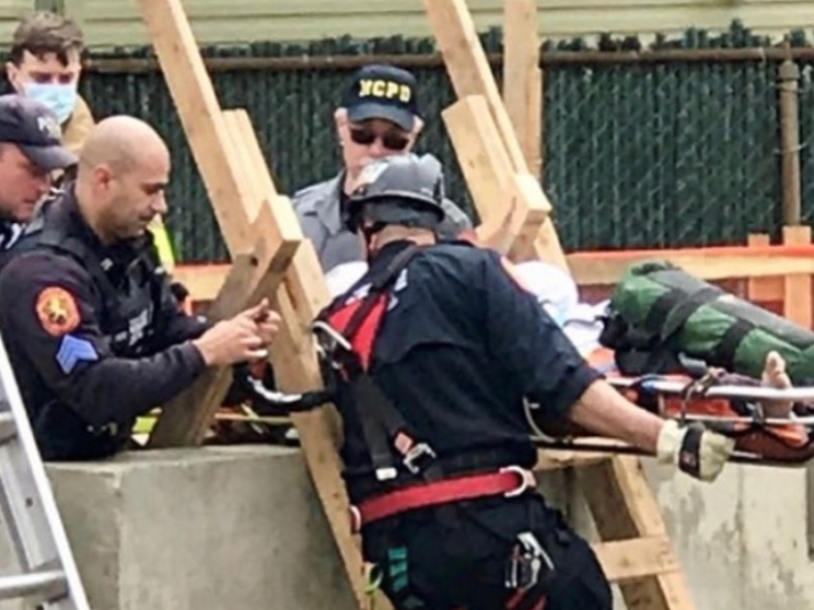 Nassau County Emergency Services officers rescued a construction worker who fell into a 25-foot-deep pit and injured his head.