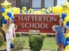 These sixth grade siblings at Chatterton School stand alongside the school sign for a photo keepsake of their time at the school.