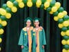 Twins Jordan Zornberg (right) and Brett Zornberg dressed in their cap and gowns for Lynbrook High School’s parent photo, yearbook and award event on June 16. 