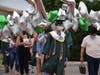 Kennedy senior Hu Cheung strolls along the Cougar walk at the June 27 graduation.