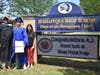 Principal Brian Conboy and guidance counselor congratulated A.J. after his graduation ceremony at the school’s electronic sign which celebrated his accomplishment.