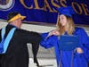 Massapequa High School senior Ashleigh Wakely exchanged an elbow bump with Principal Brian Conboy at the graduation ceremony at TOBAY Beach on July 22.
