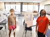 Berner Middle School incoming sixth graders Lauren Levy and Connor Reilly saw the desk barriers designed to help keep them safe when they visiting a classroom during an orientation session on Sept. 1.