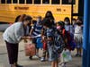 Cornwell Avenue School Principal Deanna Sinito checked students in for their first day of school in the West Hempstead School District on Sept. 3. 