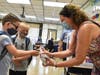 First grade teacher Geraldine Fursa was ready with hand sanitizer as her students arrived for the first day of school at Birch Lane.