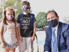 Principal Jeff Rosof greeted the Sander siblings, second grader Skylar and fifth grader Jordan.