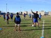 Soccer players work on skills on the field. 