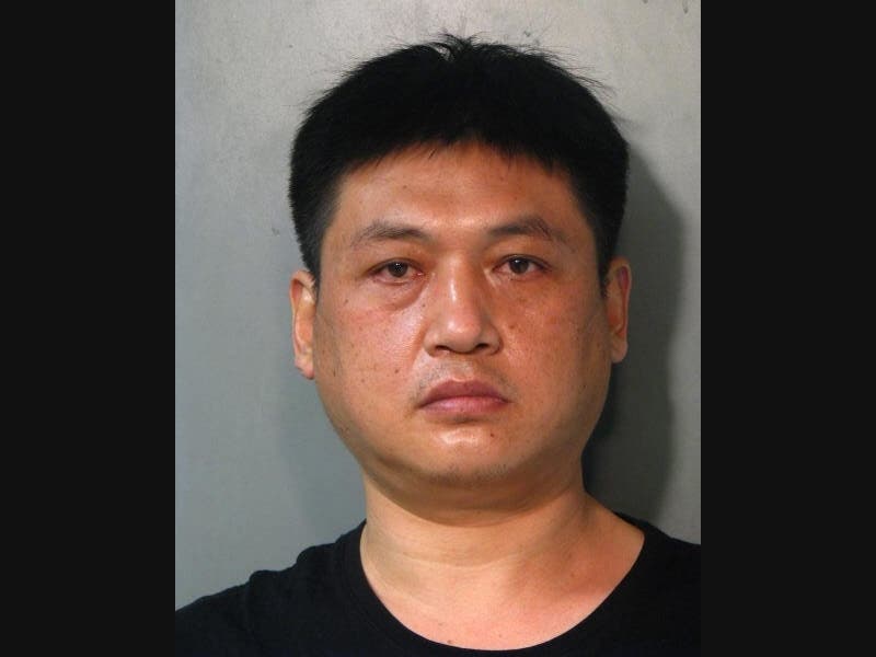 Police say while working as a masseur, Zhiaqiang Wang inappropriately touched a female client.