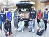 Berner Middle School student council officers, joined by advisers Kristen Meoli, left, and Denise Robertson, loaded donations from the annual Thanksgiving food drive into Ms. Meoli’s car on Nov. 24.