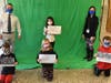 Principal Dr. Michael Yannucci and Assistant Principal Louisa Vecchione joined students who held up words of encouragement in front of the green screen for the video.