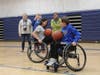 Highlands Middle Schools Students learn about regulation dribbling for Wheelchair Basketball.