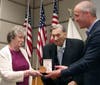 Herbert D'Alessandro's widow, Joan receives the C.A.P. Congressional Gold Medal from U.S. Rep. Sean Maloney.