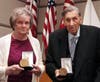 Joan D'Alessandro and Raymond D'Alessandro with Civil Air Patrol Congressional Gold Medals.