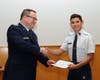 Major Philip Feldman congratulates Cadet Chief Master Sergeant Eduardo Gonzalez for receiving the New York State Assembly Certificate of Achievement.