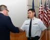 Major Phil Feldman presents the Red Service ribbon to Cadet Tech Sergeant Frank DiMicco. 