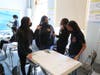 Uncommon Collegiate Charter High School students discuss COVID-19 as part of an extracurricular class about the virus.