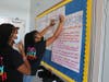 Uncommon Collegiate Charter High School students prepare a presentation about COVID-19 as part of an extracurricular class about the virus.