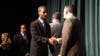 Garret Griffith, a senior from Bloomfield, receives his First Honors certificate and handshake from Christian Cashman. 