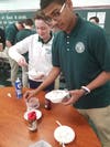 Jehyvic Spencer (right) of West Hartford and James Mullarkey of Hartford build their ice cream sundaes.