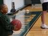 A student from Trinity Academy of Hartford enjoys shooting hoops with Northwest Catholic seniors during a Halloween celebration hosted by the Class of 2019.