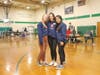 Northwest Catholic Student Council’s Community Service Commissioners, Sarah Monarca, Emma Wilkos, and Charlene Lam smile for a photo in front of the school’s November blood drive.
