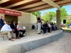 Milwaukee Mayor Tom Barrett addresses the crowd from the stage at the new Indaba Band Shell at St. Ann Center's Bucyrus 