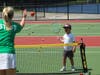 child playing tennis