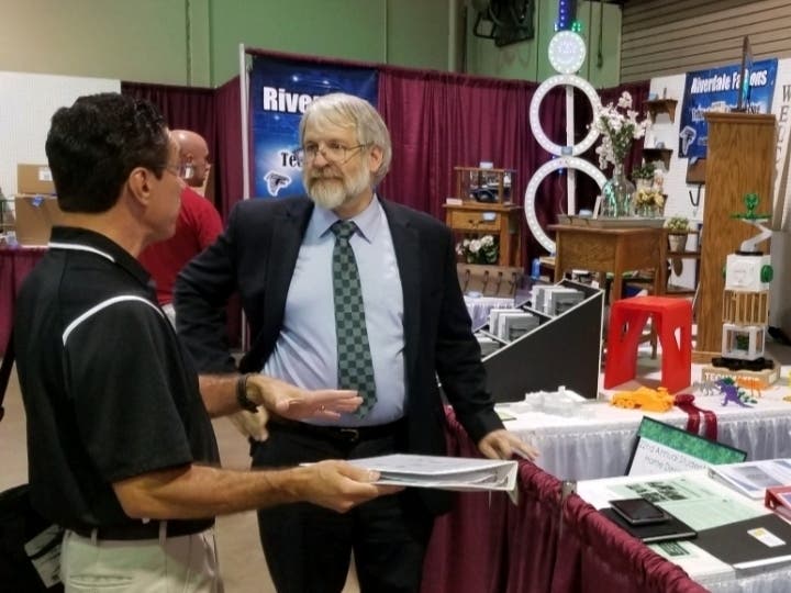 Westlake High teacher Scott Kutz talks about his students with State Superintendent Paolo DeMaria. 