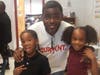 David Watkins poses with two of his grandchildren. 