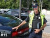 Community Services Officer Timothy Gut pauses for a photo during the meal distribution. 