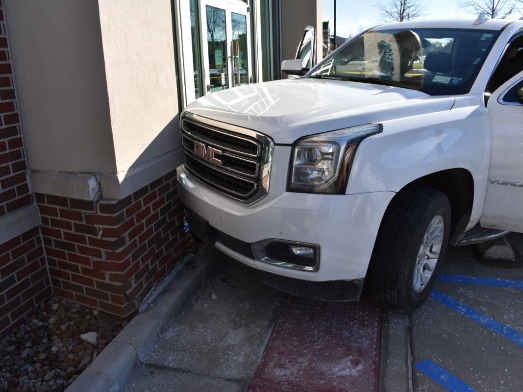 A white SUV was rammed into the PNC Bank on Crocker Road, police said Thursday.