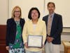 Superintendent Dr. Maureen Reusche, June Park, and School Board President Larry Feinberg.