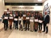 Principal Scott Weinstein poses with some of the Harriton High School students who were recognized after the meeting.