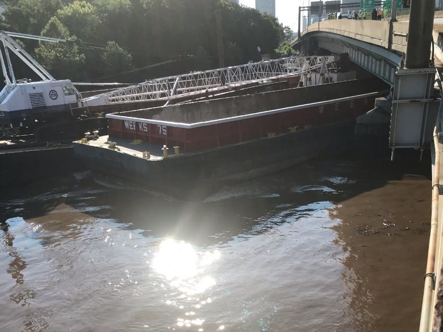 A barge got loose during Tuesday's storm and struck the Vine Street Expressway bridge.