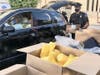 A Lower Merion Police officer unloads donated items Tuesday.
