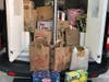 One police van and one police SUV were filled with donated foods.