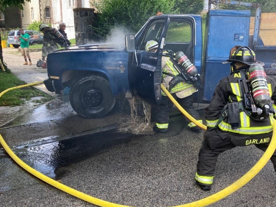 Firefighters extinguish a truck fire in Ardmore Monday morning.