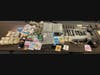 Pictured is a fraction of the drugs and guns seized by state and local authorities in West Philadelphia.