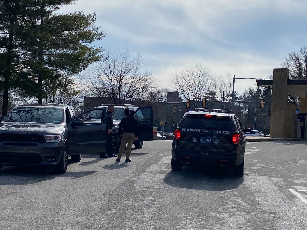 Police at the scene, where the body of an unidentified man was found at 7 a.m.