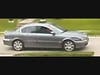 The woman sought in connection with recent package thefts was driving a gray Jaguar sedan with damage to the front passenger side.