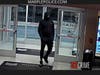 The suspect was described as a black man, tall and thin, wearing all black clothes and a black ski mask.