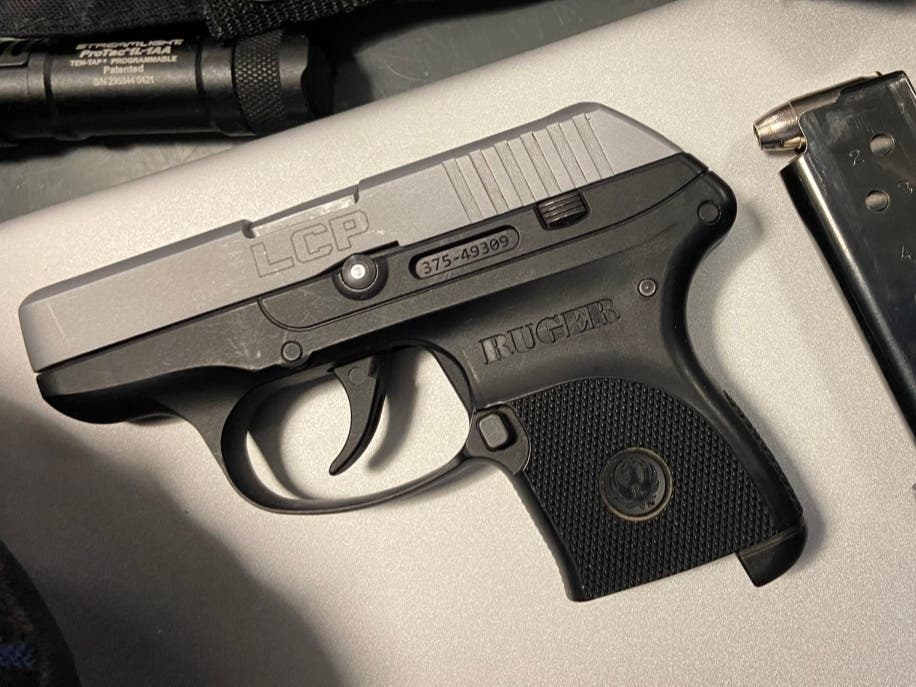 Officers found a .380 caliber handgun loaded with seven rounds, one of which was in the chamber, while doing an X-ray scane of the passenger's bags Saturday.