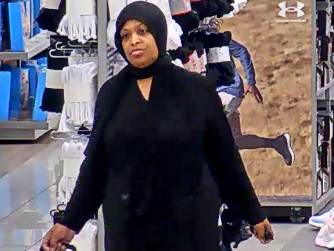 The woman seen here stole Under Amour and Nike clothes then drove off in a Mercedes-Benz, police said.