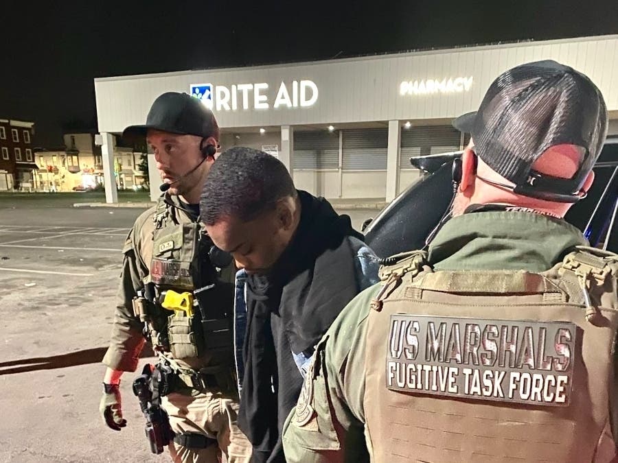 Nasir Grant being taken into custody by the U.S. Marshals Service Thursday night in Philadelphia.