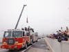 Engine 38 of the Philadelphia Fire Department, which was first to respond to the June 11 crash and fire, was the first vehicle to cross the temporary road on Interstate 95 in Philadelphia Friday.