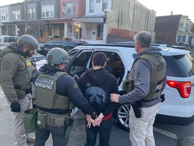 A 20-year-old man was taken into custody on murder charges Thursday after authorities said he fatally shot his girlfriend in December last year.