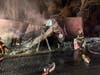 These firefighters worked through the night to extinguish the fire and to save the contents of the trailer.