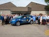 Rochester Rotary Club poses with the local Rotary District "Polio Car"