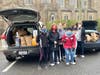 Club members gathered to receive donations for the food drive.